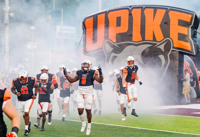 Football team running onto field